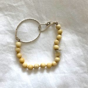 Beautiful beaded bracelet with sterling silver accent. Hand hammered.